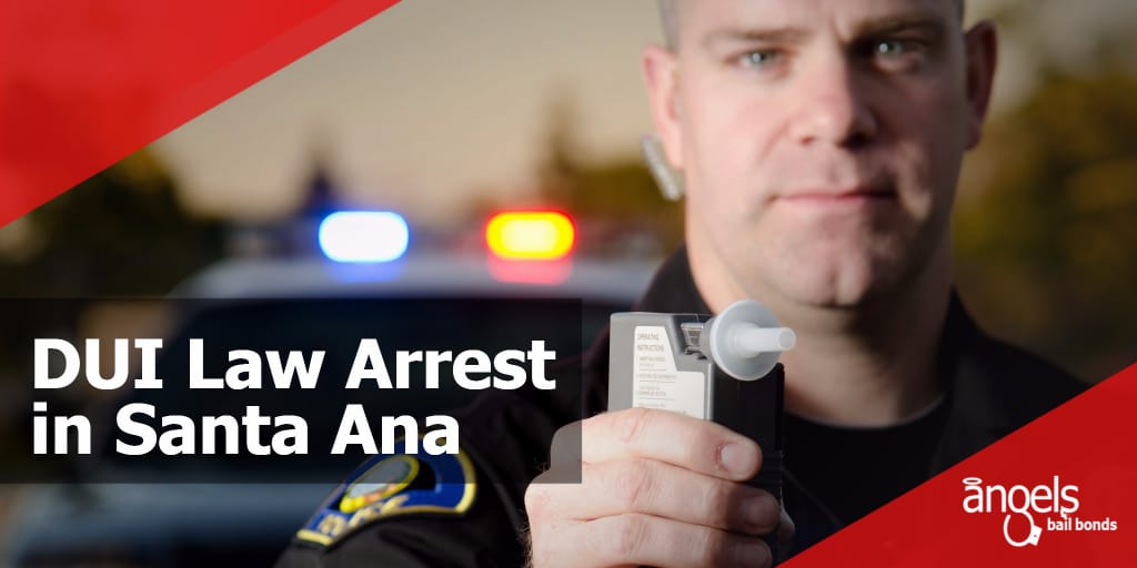 a police officer holding up a breathalyzer